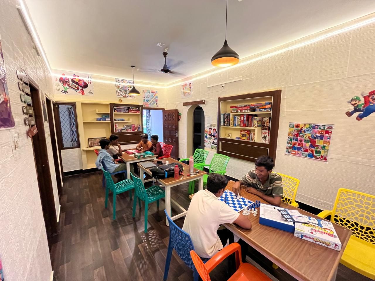 Board games room with friends playing chess at KGG